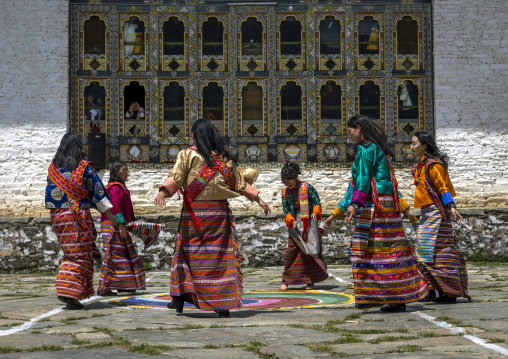 Bhutanese women dancing during Ura Yakchoe festival, Bumthang, Ura, Bhutan