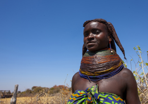 Mumuhuila tribe teenage girl wearing a huge necklace, Huila province, Chibia, Angola