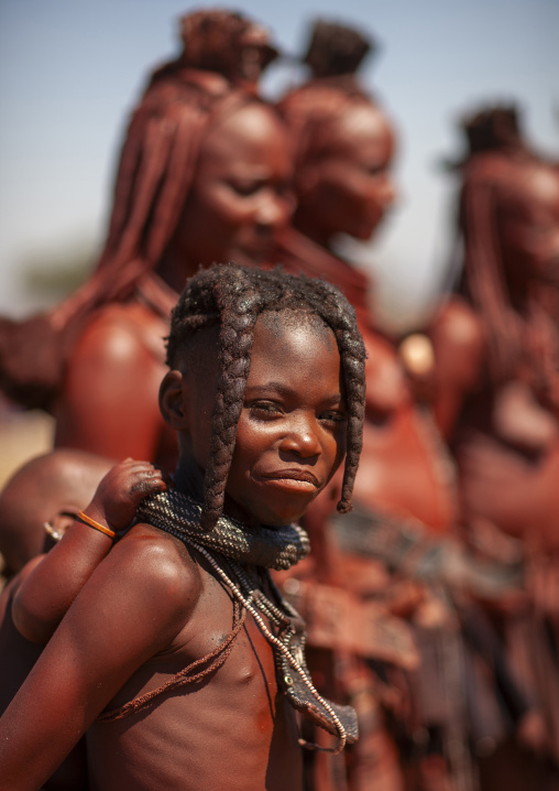 MuHimba girl carrying a baby on her back, Cunene province, Oncocua, Angola1