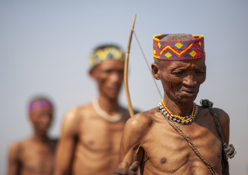 San hunters walking in the bush, Otjozondjupa, Tsumkwe, Namibia