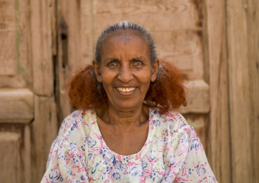 Smiling eritrean woman with traditional hairstyle, Northern red sea, Massawa, Eritrea