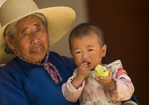 Grandmother and baby, Xizhou, Yunnan province, China