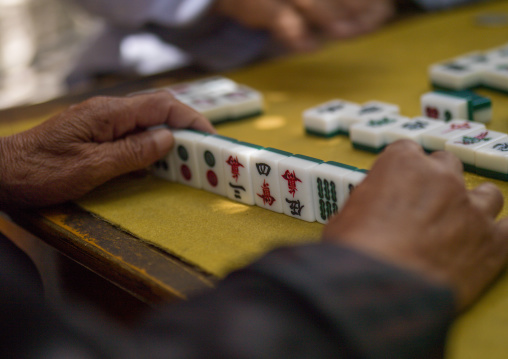 Man playing chinese chess, Xizhou, Yunnan province, China