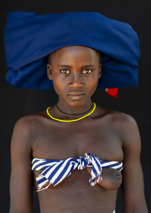 Mucubal tribe woman with the ompota headdress, Namibe Province, Virei, Angola
