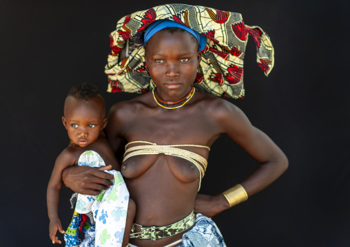 Mucubal tribe woman holding her baby, Namibe Province, Virei, Angola