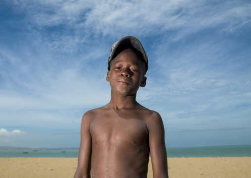 Boy with cap on the beach, Benguela Province, Benguela, Angola