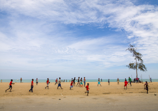 Boys playing football on the beach, Benguela Province, Benguela, Angola