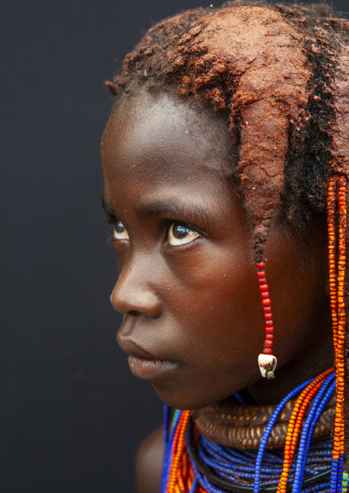 Shy Mwila girl with beaded ornaments, Huila Province, Chibia, Angola