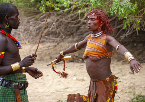 Whipping of a Hamer woman during bull leaping ceremony, Omo valley, Turmi, Ethiopia