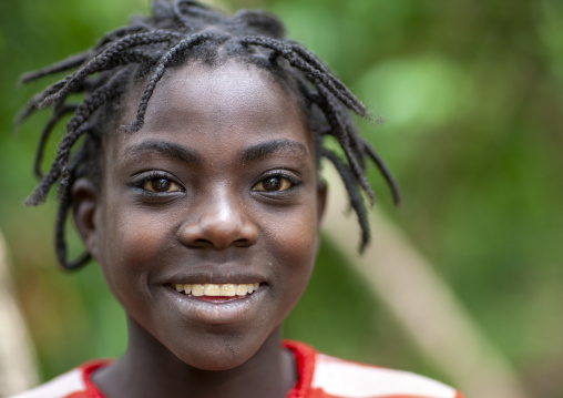 Portrait of Ari tribe teenage girl with braided hair, Ari zone, Jinka, Ethiopia