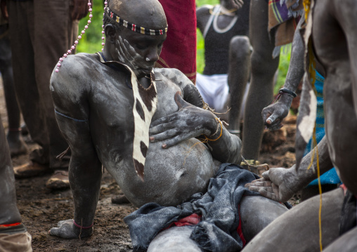Bodi tribe men putting ashes during Kael cceremony, Omo Valley, Hana Mursi, Ethiopia