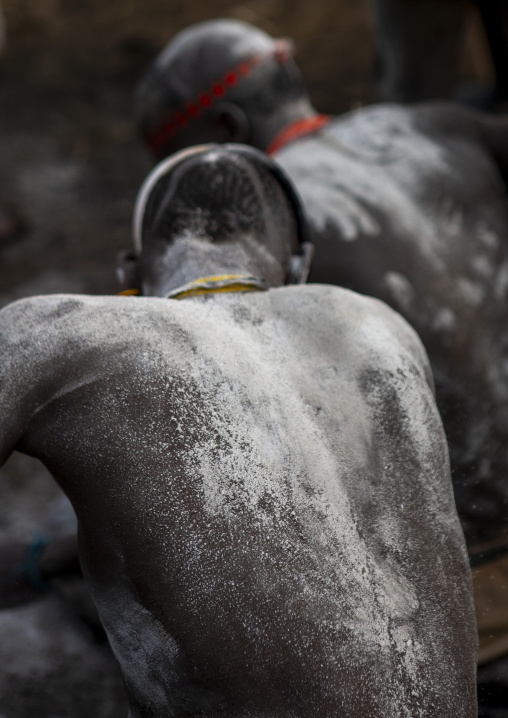 Bodi tribe men putting ashes during Kael cceremony, Omo Valley, Hana Mursi, Ethiopia