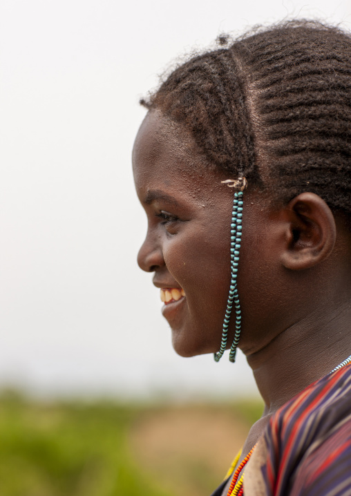 Young woman with braided hair and beads ornament, Omo Valley, Turmi, Ethiopia