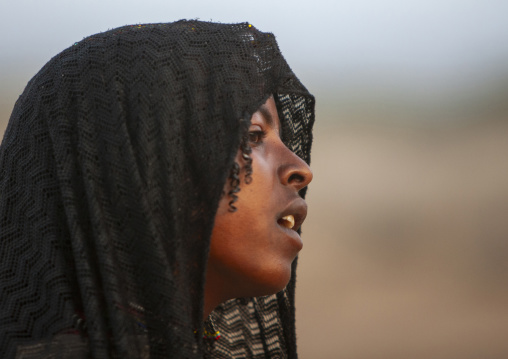 Portrait of a Karrayyu teenage girl with veil, Oromia, Metehara, Ethiopia