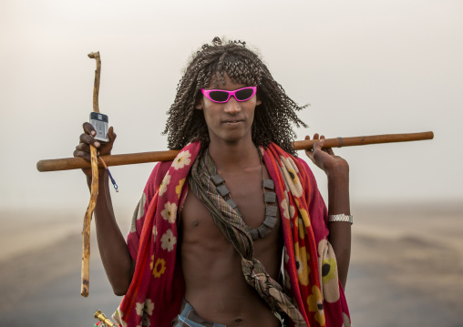 Afar tribe man with sunglasses on a road, Afar Region, Assayta, Ethiopia