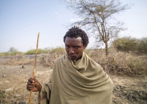 Portrait of a Karrayyu man with a stick, Oromia, Metahara, Ethiopia
