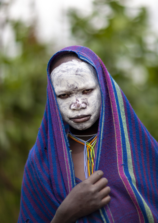 Young suri woman with painted face, Kibbish, Omo valley, Ethiopia