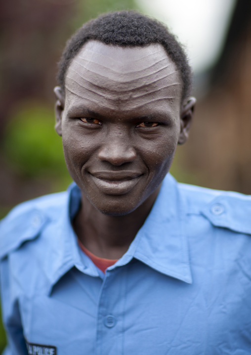 Policemean from Nuer tribe with scarifications on the forehead, Gambella province, Gambella, Ethiopia