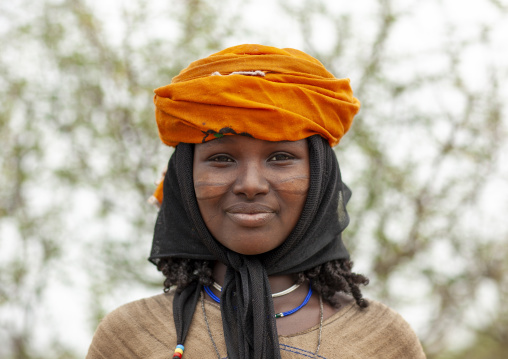 Karrayyu young woman with scarifications on her face, Oromia, Metahara, Ethiopia