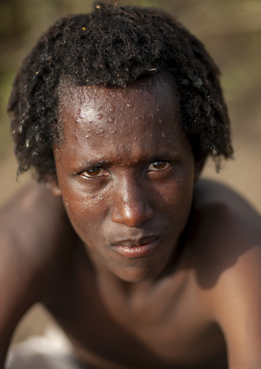 Portrait of a Karrayyu man with traditional hairstyle, Oromia, Metahara, Ethiopia