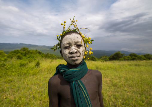 Surma boy wearing flower ornaments, Kibish, Omo valley, Ethiopia
