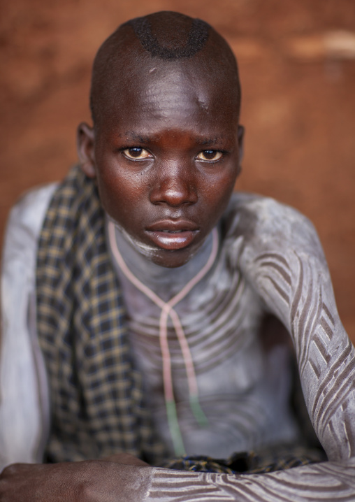 Suri tribe boy with a painted body, Kibish, Omo valley, Ethiopia