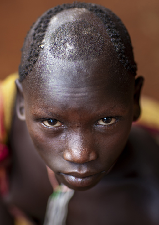 Suri tribe boy with artistic haircut, Kibish, Omo valley, Ethiopia
