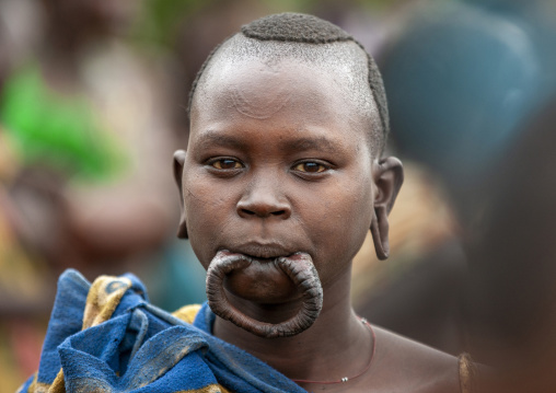 Suri tribe girl with an enlarged lip, Kibish, Omo valley, Ethiopia