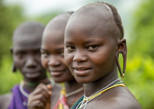 Suri tribe women with enlarged earlobe, Kibish, Ethiopia