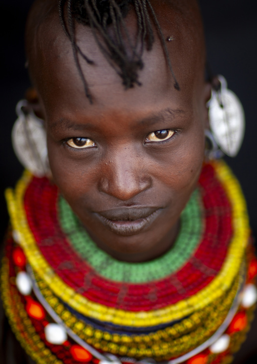 Turkana tribe woman with huge necklaces and earrings, Turkana lake, Loiyangalani, Kenya