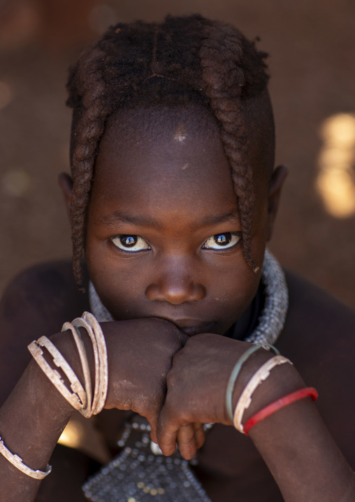 Young Himba tribe girl with traditional hairstyle, Kunene region, Epupa, Namibia