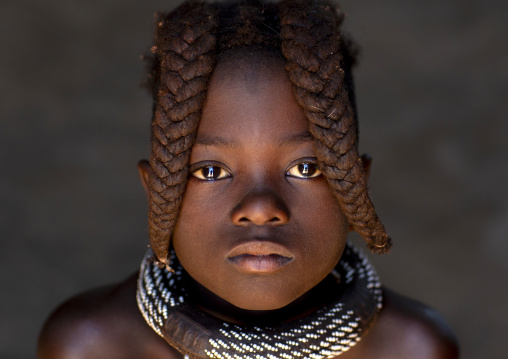 Young Himba tribe girl with traditional hairstyle, Kunene region, Epupa, Namibia