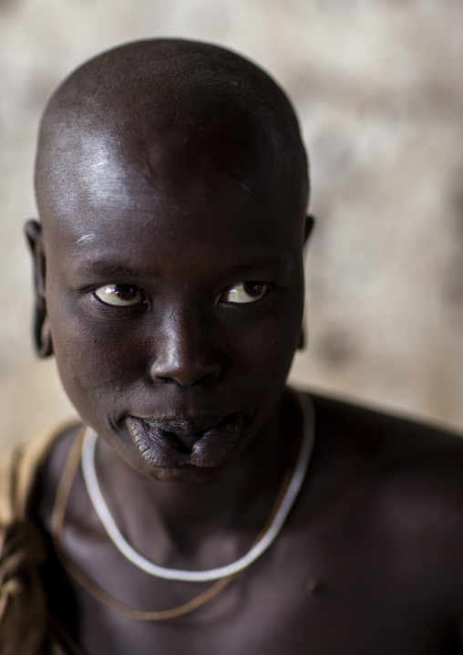 Young Mursi tribe woman with enlarged lip, Mago national park, Omo valley, Ethiopia