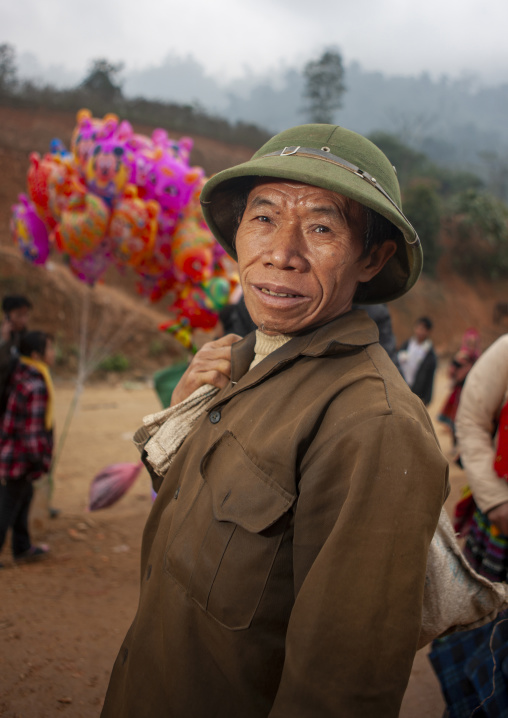 Man with a colonial helmet on a market, Lao Cai province, Sapa, Vietnam