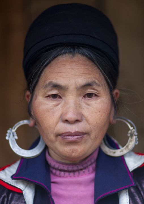 Black Hmong woman with traditional silver earrings, Lao Cai province, Sapa, Vietnam