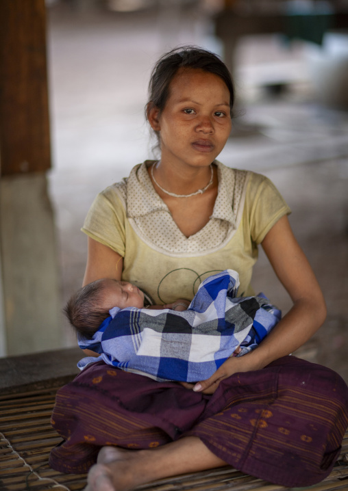 Portrait of a Bru minority mother and her baby, Champassak province, Phonsaad, Laos