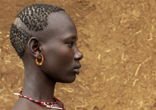 Young Bodi tribe woman with traditional hairstyle, Hana Mursi, Omo valley, Ethiopia
