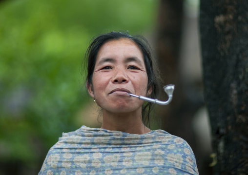 Khmu minority woman smoking pipe, Xiangkhouang province, Xieng Khouang, Laos
