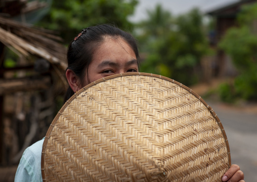 Thai kaho minority woman with a bamboo hat, Khammouane province, Ban Sam Kang, Laos