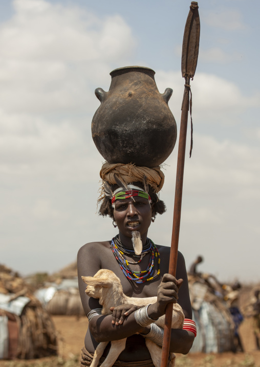 Dassanech tribe woman carrying a pot on her head, Omorate, Omo valley, Ethiopia