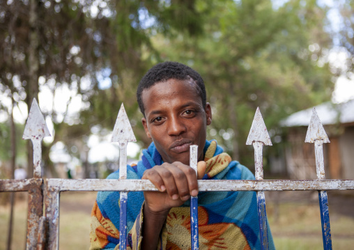 Man standing behind a fence, Addis Ababa region, Addis Ababa, Ethiopia
