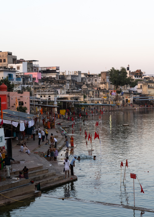 Indian pilgrims in Barhama lake and bathing ghats, Rajasthan, Pushkar, India