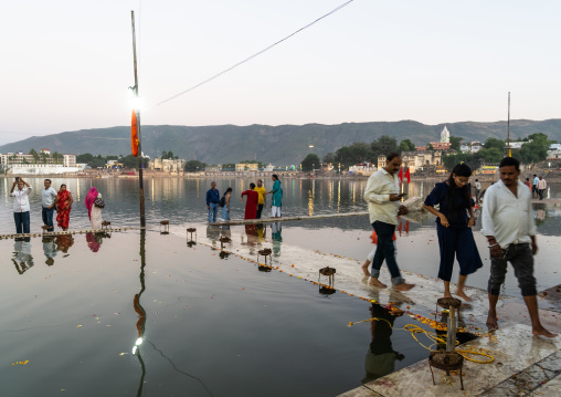 Indian pilgrims in Barhama lake and bathing ghats, Rajasthan, Pushkar, India