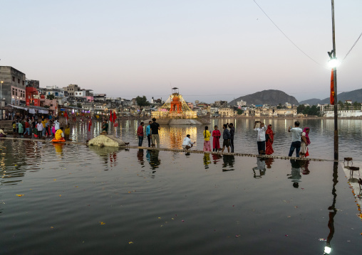 Indian pilgrims in Barhama lake and bathing ghats, Rajasthan, Pushkar, India