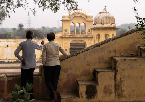 Indian men in front of a stepwell, Rajasthan, Ramgarh Shekhawati, India