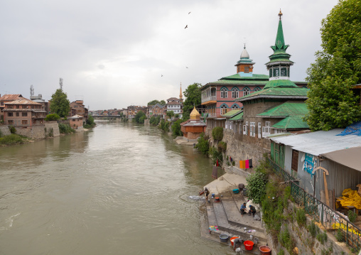 Men washing clothes on the ghat of Jhelum River, Jammu and Kashmir, Srinagar, India