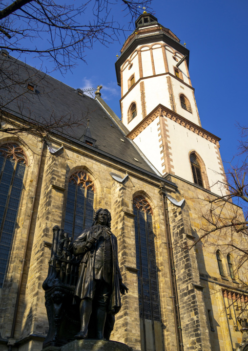 Statue of composer Johann Sebastian Bach with organ in front of St Thomas Church, Saxony, Leipzig, Germany