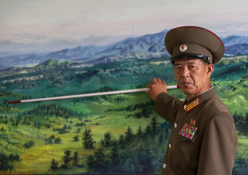 Soldier in the DMZ in front of the map of the wall, North Hwanghae, Panmunjom, North Korea
