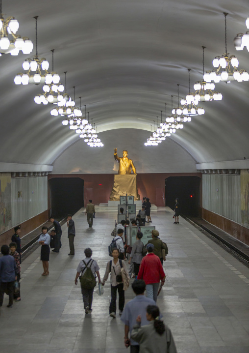 People reading the offical state newspaper in Kaeson metro station, DGC, Pyongyang, North Korea