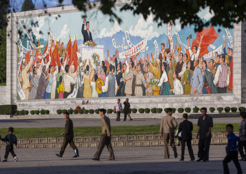 North Korean people passing in front of a giant young Kim il Sung mosaic, DGC, Pyongyang, North Korea